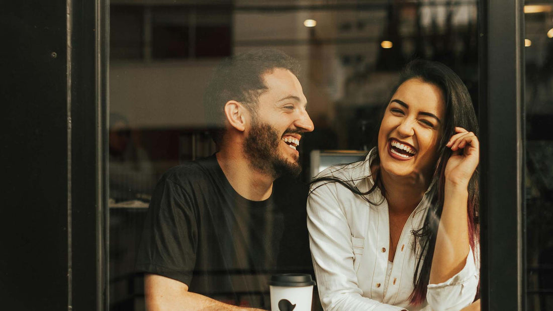 Laughing couple in a cafe