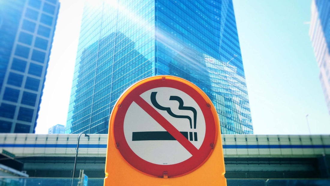 a yellow signage in the middle of the city