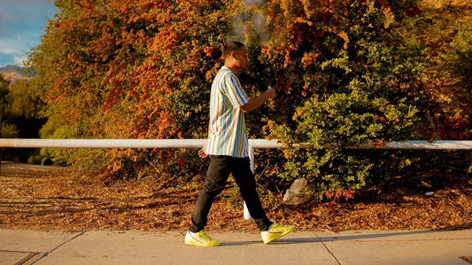 Man walking down the street and vaping