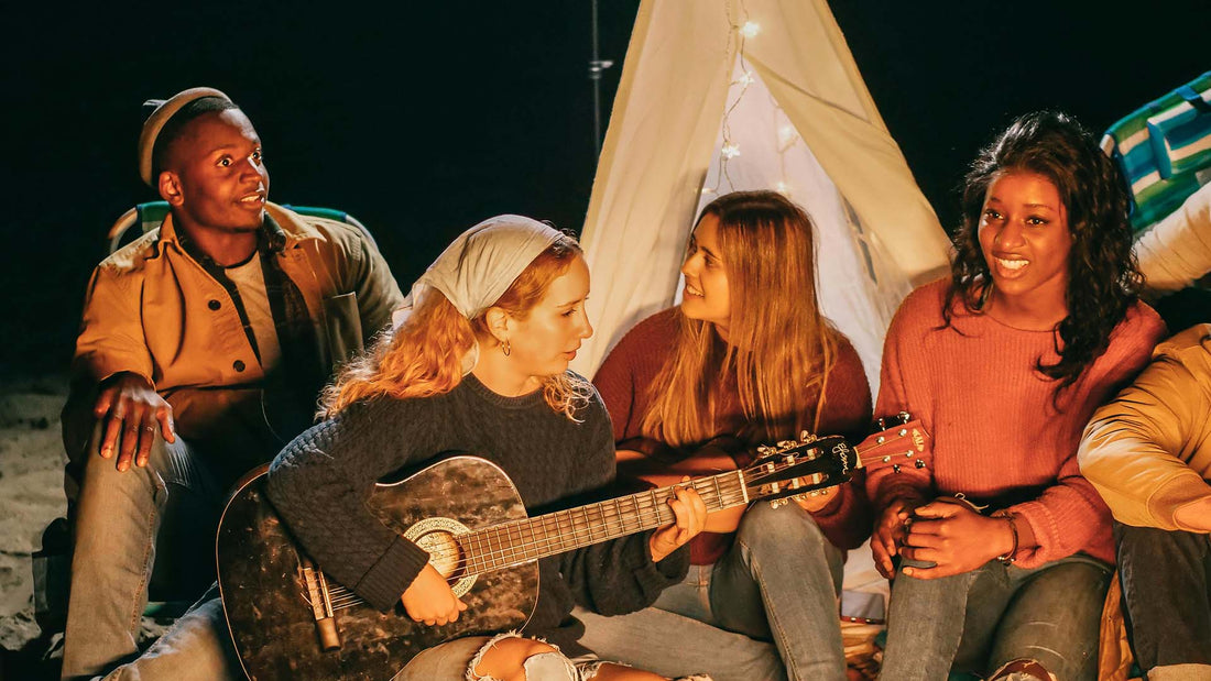 group of friends singing and playing guitar