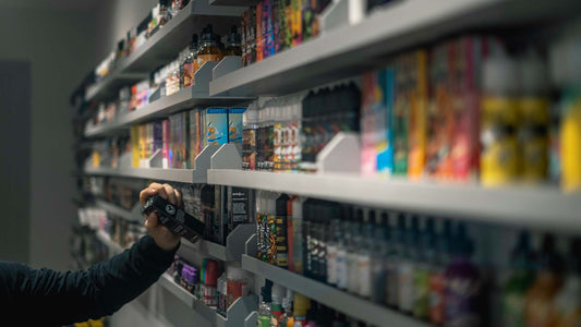 A person picking products on a store shelf.