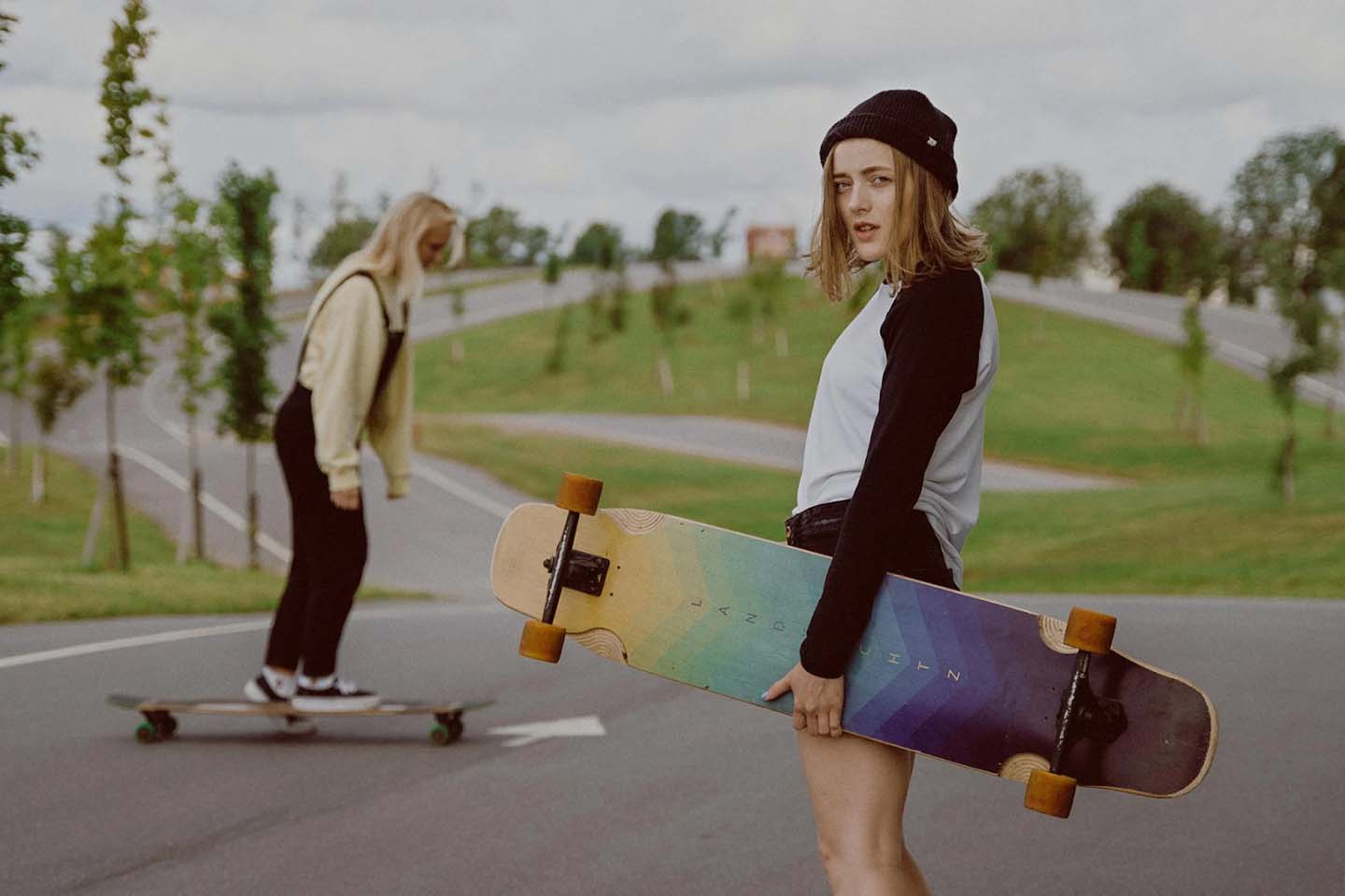 Woman holding a skateboard