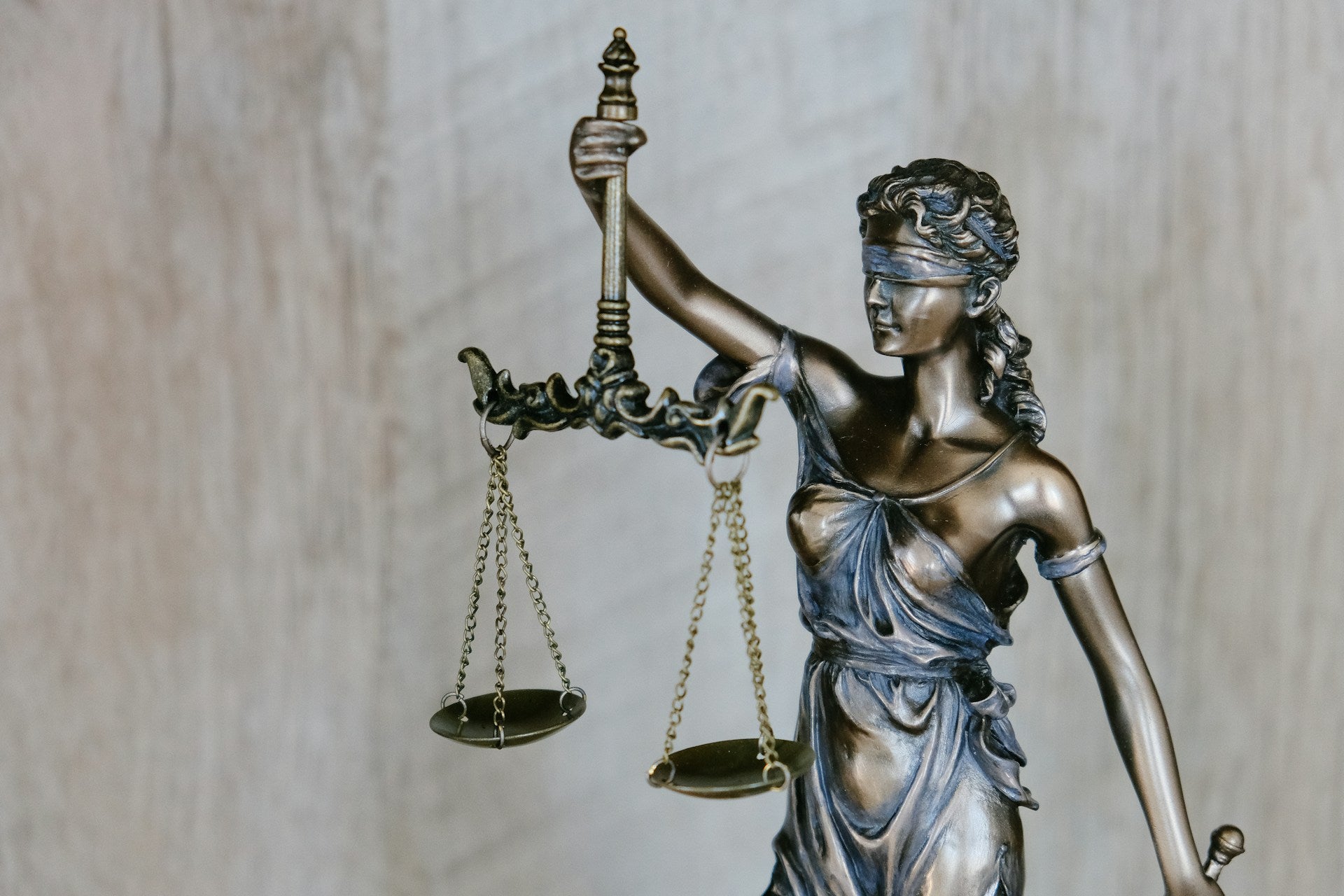 Statue of Lady Justice holding a scale