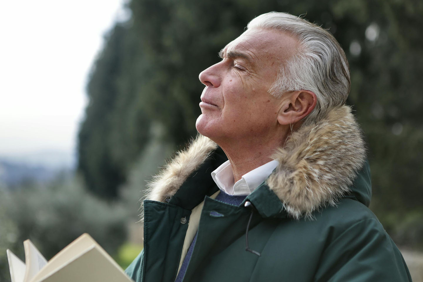 Man taking a deep breath with his eyes closed