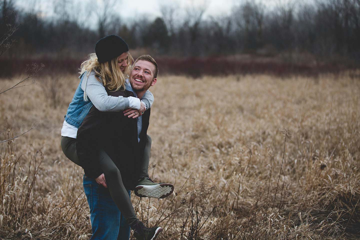 Man carrying a woman on his back